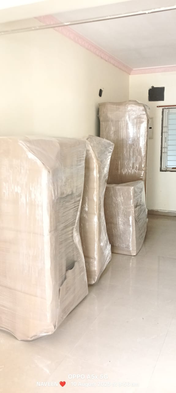 Sridurga team loading sealed cartons into dedicated container vehicle in Vizianagaram