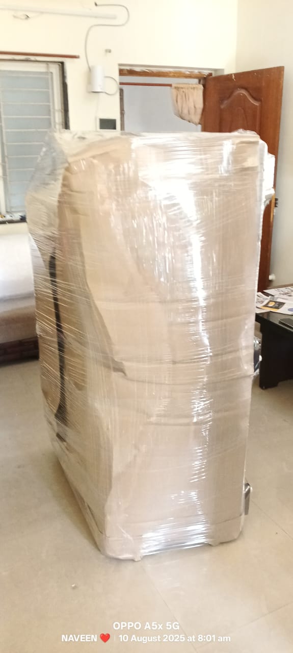 Uniformed Sridurga packing crew handling customer household shifting
